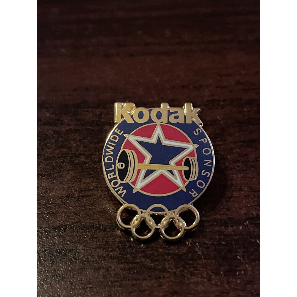 Vintage Kodak Worldwide Sponsor Weightlifting Olympics Lapel Hat‎ Pin